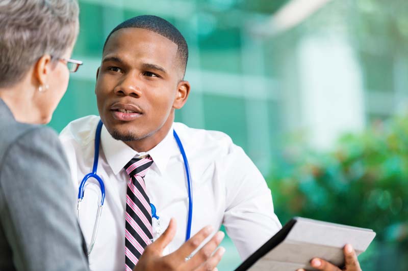 A doctor consults with a patient