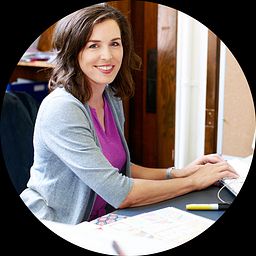Female teacher working remotely on a desktop computer